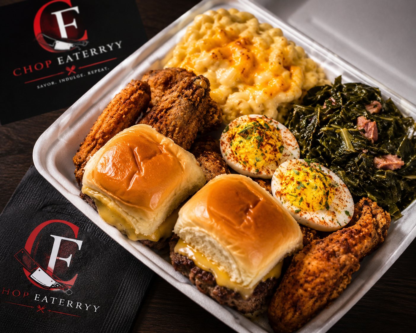 Chop Eateryy signature plate with fried wings, sliders, mac and cheese, collards, and deviled eggs